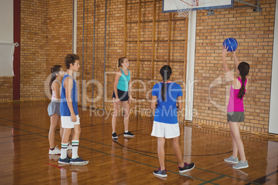 High school kids playing basketball