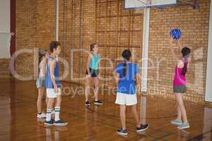 High school kids playing basketball