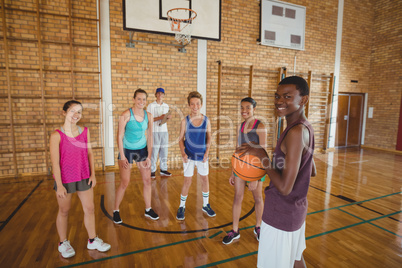 Portrait of high school kids playing basketball