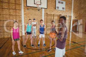 Portrait of high school kids playing basketball