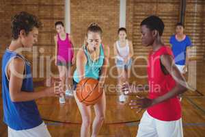 High school kids about to start playing basketball