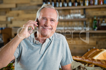 Portrait of senior man talking on mobile phone