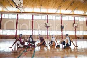 Basketball players interacting while relaxing