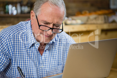 Senior man working on computer