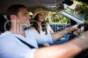 Young couple sitting car