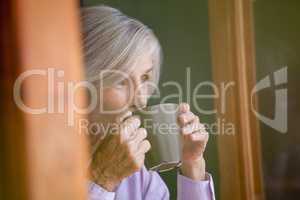 Close up of senior woman drinking coffee