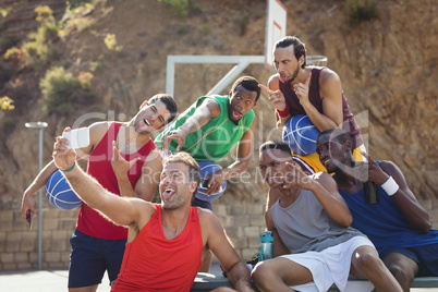 Basketball players taking a selfie