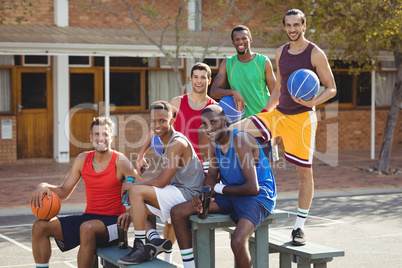 Basketball players sitting on the bench