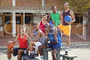 Basketball players sitting on the bench