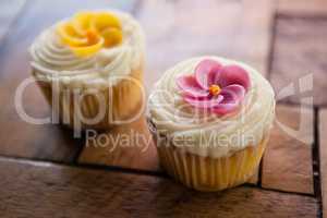 Close up of cupcakes on wooden table
