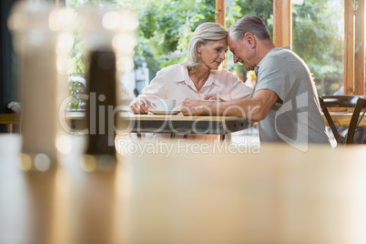 Senior couple sitting together in cafÃ?Â©