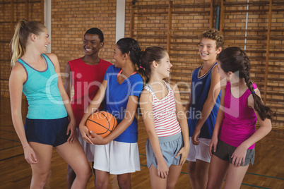 High school kids having fun in basketball court