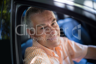 Senior man traveling in car