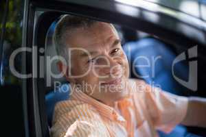 Senior man traveling in car