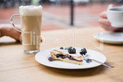 Tart with blackberries and blueberries on a plate
