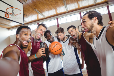 Happy basketball players making funny faces