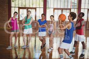 High school boy about to take a penalty shot while playing basketball