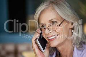 Close up of smiling senior woman talking on smart phone