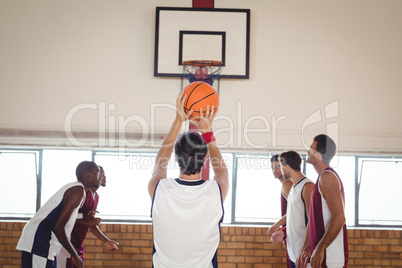 Basketball player about to take a penalty shot while playing basketball