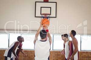 Basketball player about to take a penalty shot while playing basketball