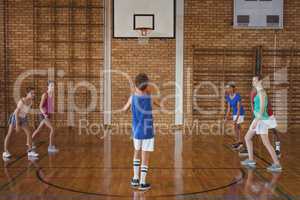 High school boy about to take a penalty shot while playing basketball