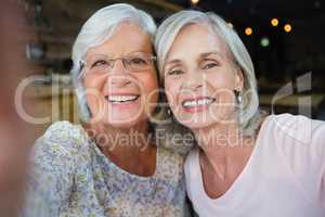 Two senior woman sitting together in cafÃ?Â©