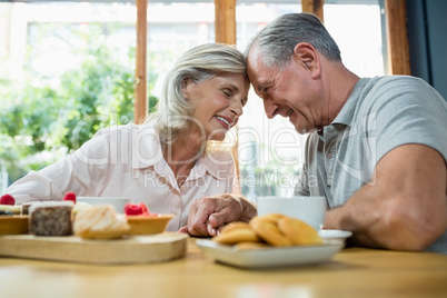 Senior couple sitting together in cafÃ?Â©