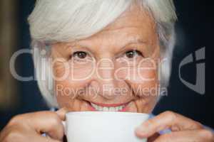 Portrait of senior woman with coffee cup