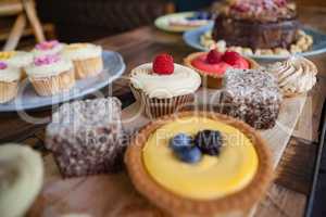 Close up of sweet food served in plate on wooden table