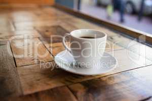 Close up of black coffee in cup on table
