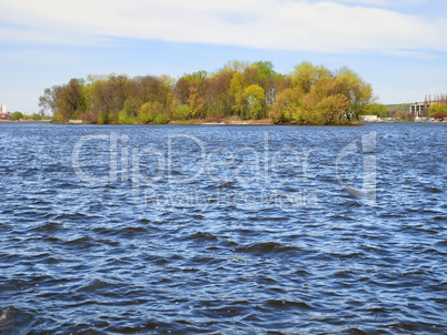 Waves on lake in fine spring weather