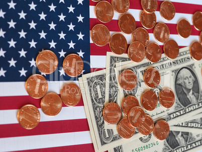 Dollar notes and coins and flag of the United States