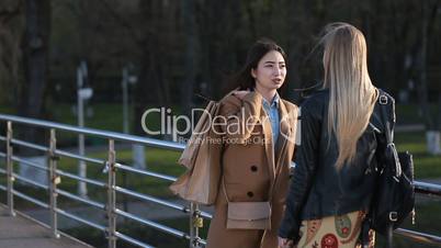 Charming asian woman communicating with friend