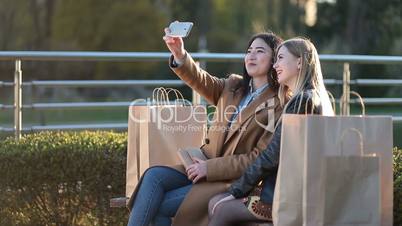 Teenage girls making self portrait with phone