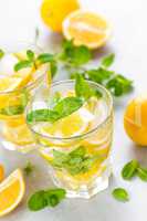 Lemon mojito cocktail with fresh mint, cold refreshing summer drink or beverage with ice