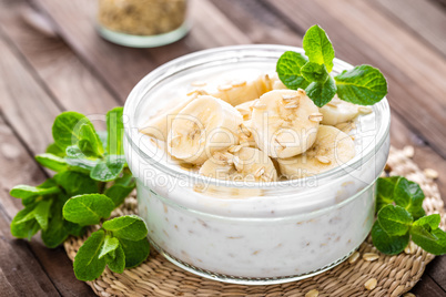 Fresh banana yogurt with oats, delicious dessert for healthy breakfast