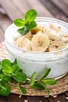 Fresh banana yogurt with oats, delicious dessert for healthy breakfast