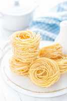 Raw pasta on white background closeup