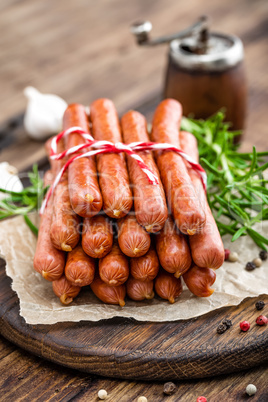 Sausages on wooden background