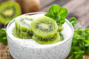 Fresh kiwi yogurt with fruits and chia seeds, healthy breakfast