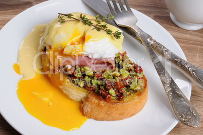 Toast with guacamole with egg Benedict