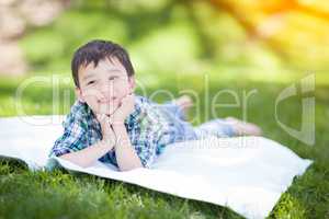 Mixed Race Chinese and Caucasian Young Boy Relaxing Outside On T