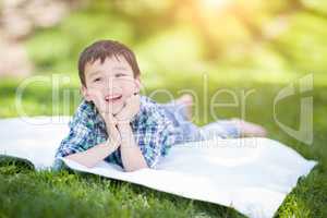 Mixed Race Chinese and Caucasian Young Boy Relaxing Outside On T