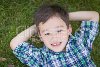 Thoughtful Mixed Race Chinese and Caucasian Young Boy Relaxing O