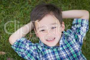 Thoughtful Mixed Race Chinese and Caucasian Young Boy Relaxing O