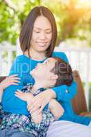 Outdoor Portrait of Chinese Mother with Her Mixed Race Chinese a