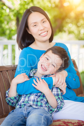 Outdoor Portrait of Chinese Mother with Her Mixed Race Chinese a