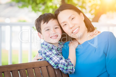 Outdoor Portrait of Chinese Mother with Her Mixed Race Chinese a