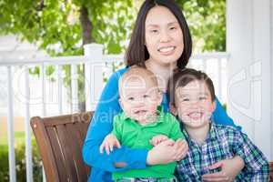 Outdoor Portrait of A Chinese Mother with Her Two Mixed Race Chi