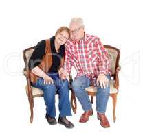 Lovely senior couple in armchair.